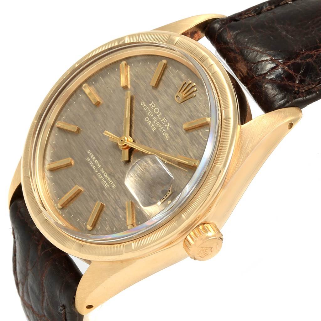 The Rolex Vintage Collection 1501 Men's Yellow Gold Brown Dial 1501 Men's Yellow Gold Brown Dial model watch shown is angled to display the dial, crown, and a portion of the leather strap.