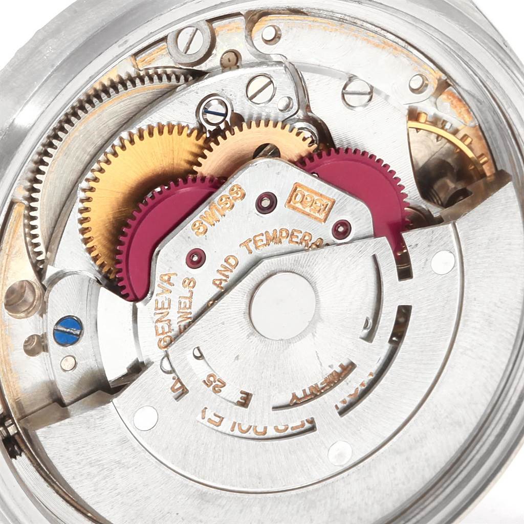 This close-up image shows the inner mechanical components and gears of a Rolex Vintage Collection 1601 Men's Stainless Steel Silver Dial 1601 Men's Stainless Steel Silver Dial watch.