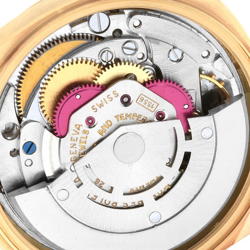 This image shows the intricate inner mechanics of a Vintage Collection Rolex watch, highlighting gears and movement components.