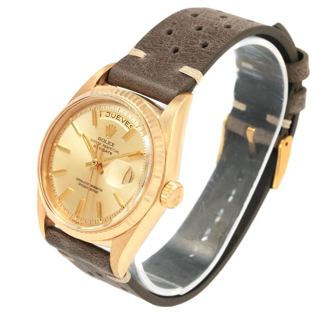 The image shows a side and front angle of a Rolex Vintage Collection 1803 Men
s Yellow Gold Champagne Dial 1803 Men
s Yellow Gold Champagne Dial watch, highlighting its face, bezel, and leather strap.