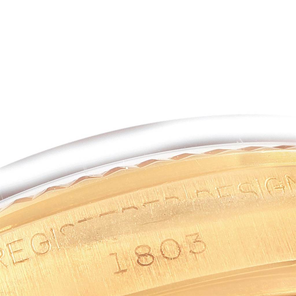 This close-up of the Vintage Collection Rolex watch shows part of the case back with the engraved model number 1803.