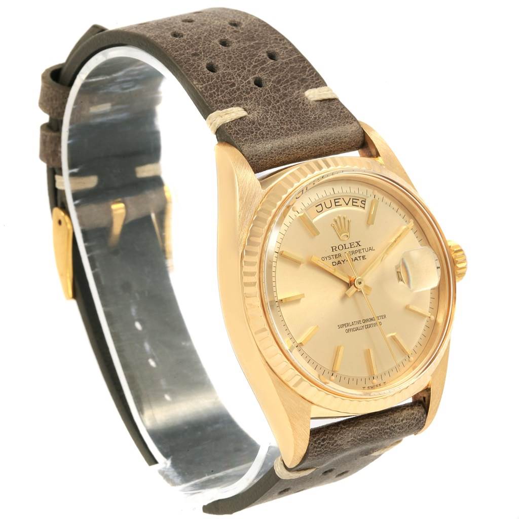The image shows a vintage Rolex Oyster Perpetual Day-Date watch from a side angle, emphasizing the face, bezel, and strap.