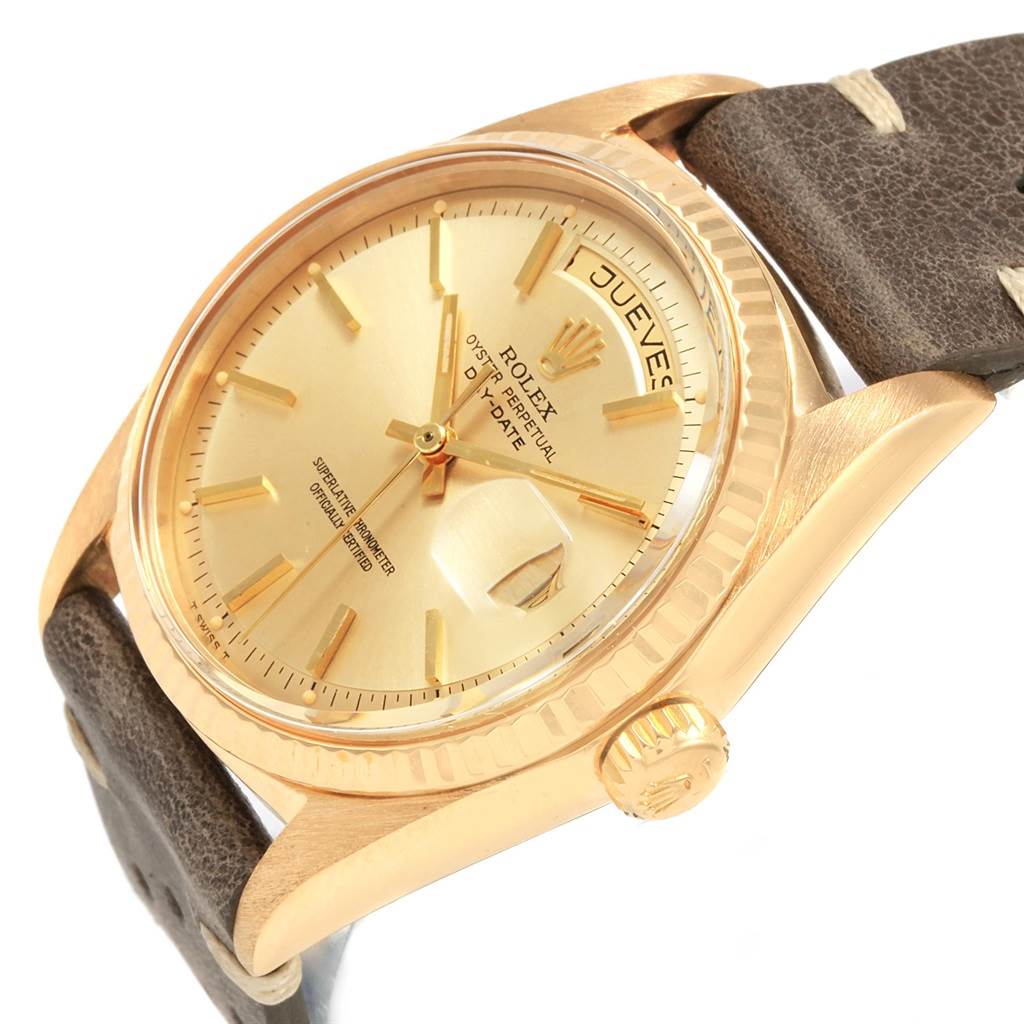 The image shows a close-up of the Rolex Vintage Collection 1803 Men
s Yellow Gold Champagne Dial 1803 Men
s Yellow Gold Champagne Dial watch from a side angle, highlighting the dial, bezel, crown, and brown leather strap.
