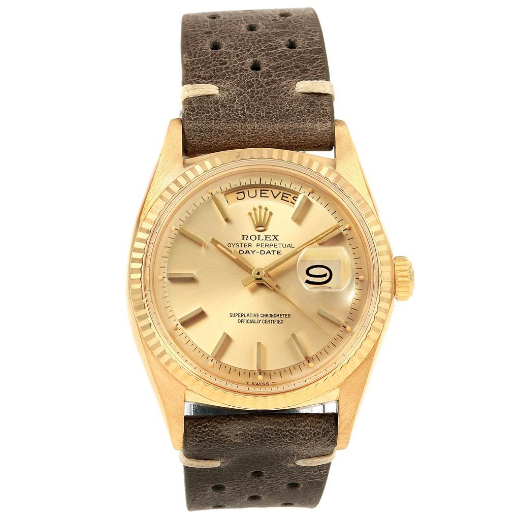 The Rolex Vintage Collection 1803 Men
s Yellow Gold Champagne Dial 1803 Men
s Yellow Gold Champagne Dial watch is shown from a top-down angle, displaying its brown leather strap and gold dial with date and day indicators.