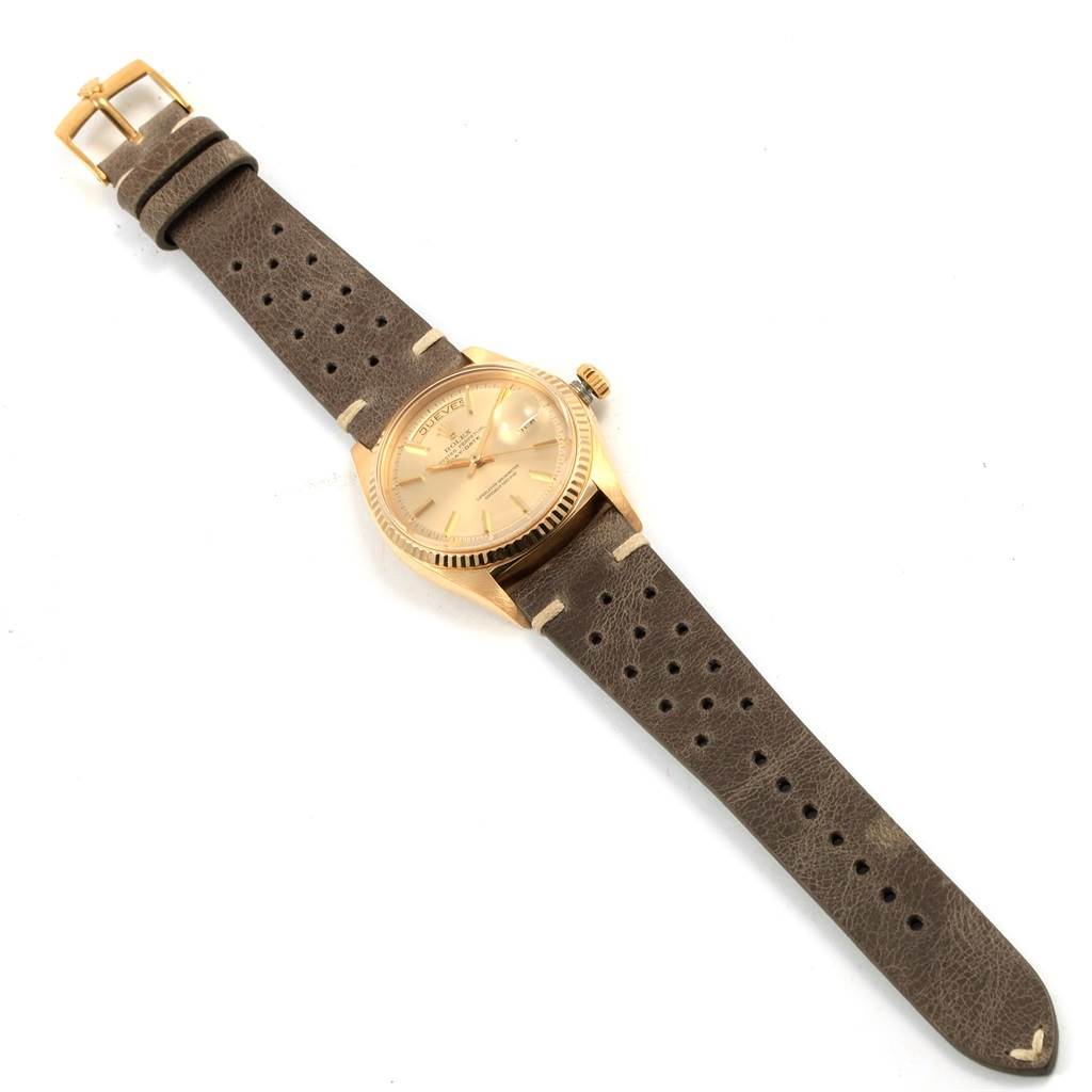 The image shows a Rolex Vintage Collection 1803 Men
s Yellow Gold Champagne Dial 1803 Men
s Yellow Gold Champagne Dial watch at a slight angle, highlighting its face, case, crown, and leather strap fully extended.