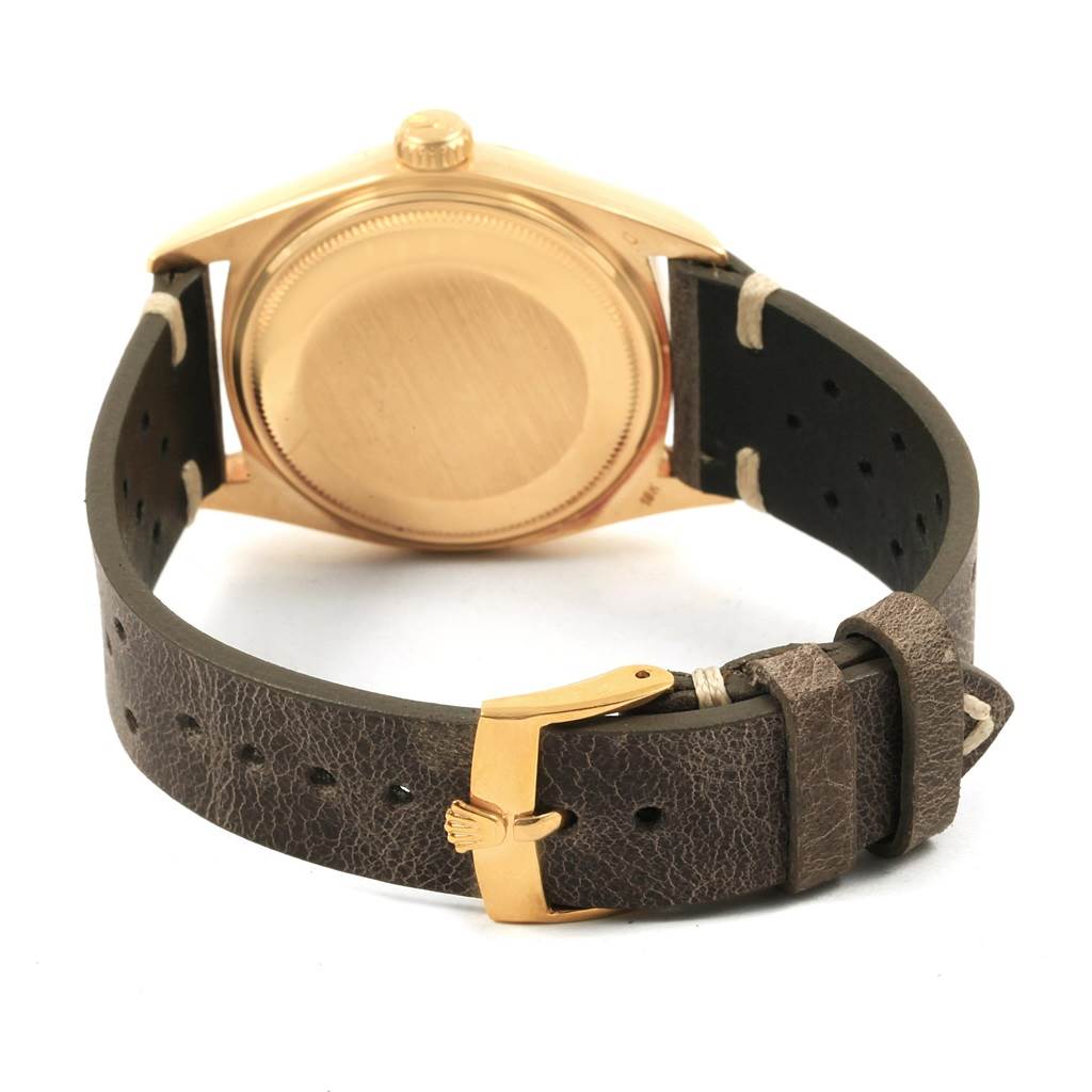 The image shows the back case and buckle of the Rolex Vintage Collection 1803 Men
s Yellow Gold Champagne Dial 1803 Men
s Yellow Gold Champagne Dial watch in a rear angle.
