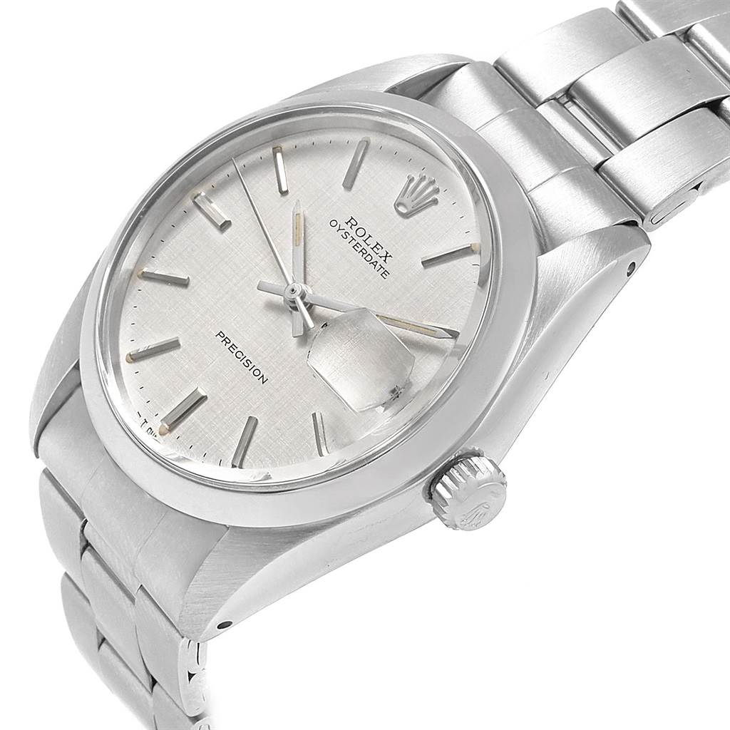The image shows a side view angle of the Rolex Vintage Collection 6694 Men's Stainless Steel Silver Dial 6694 Men's Stainless Steel Silver Dial watch, focusing on its round dial, bezel, crown, and stainless steel bracelet.