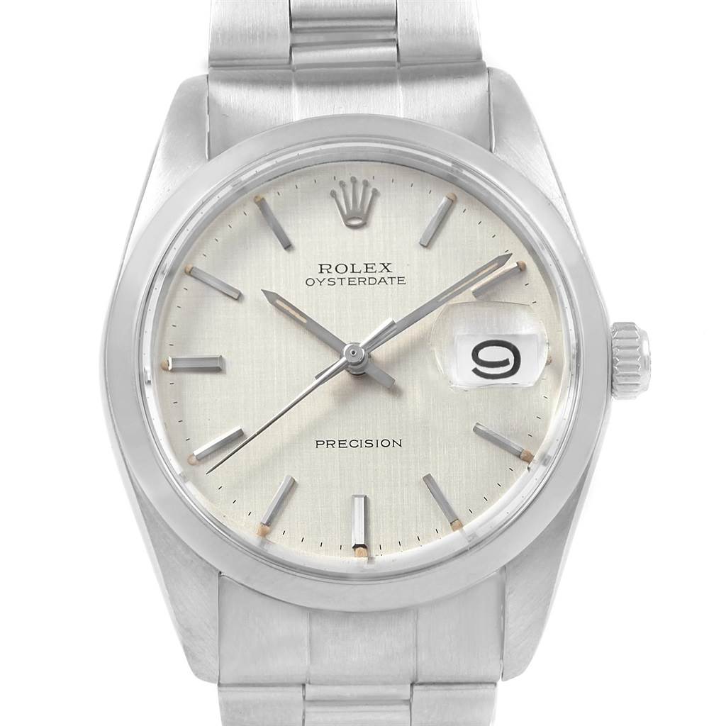 The image shows a front-facing view of a Rolex Vintage Collection 6694 Men's Stainless Steel Silver Dial 6694 Men's Stainless Steel Silver Dial Oysterdate model, highlighting the dial, crown, and bracelet.