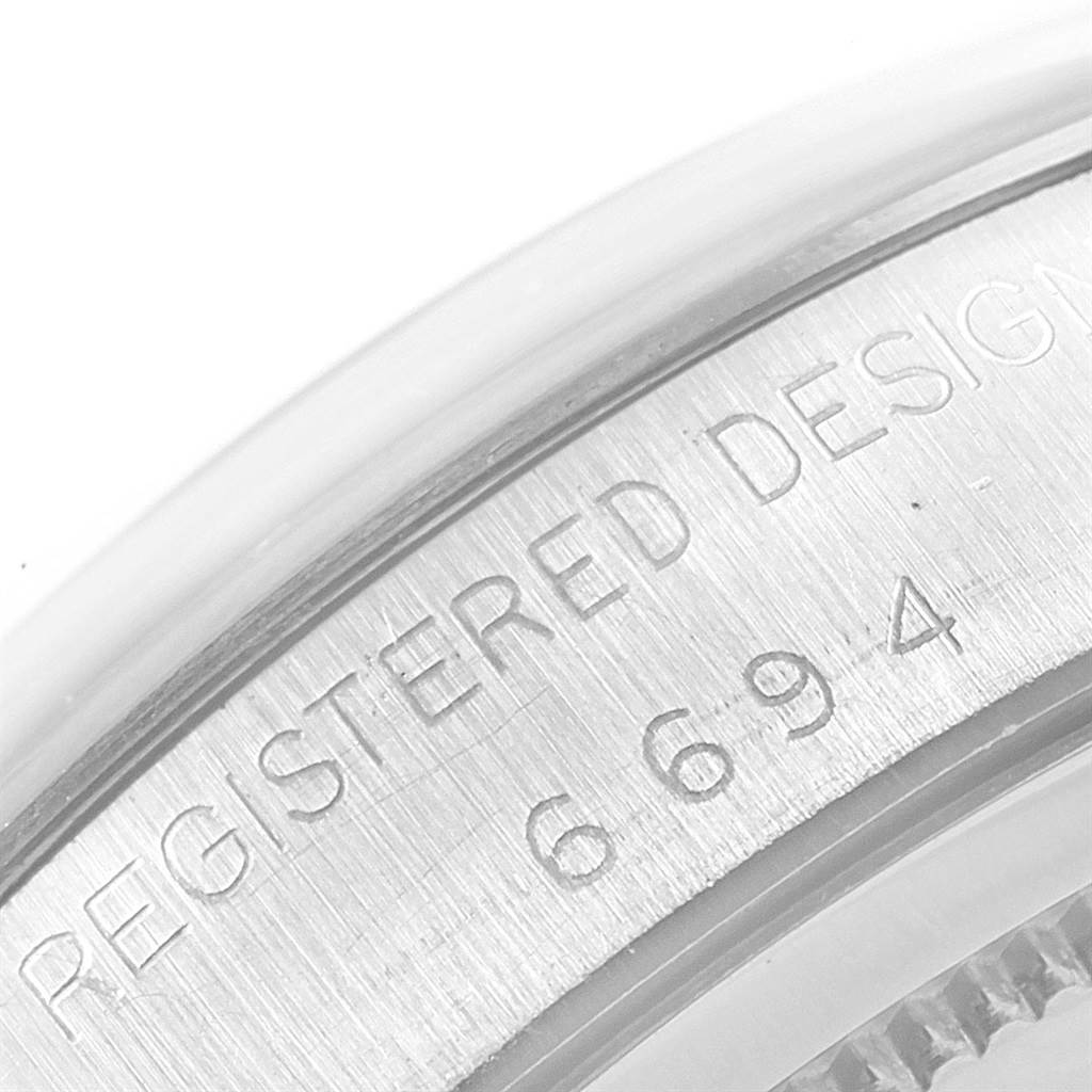 This image shows a close-up of the engraved case back of a Rolex Vintage Collection 6694 Men's Stainless Steel Silver Dial 6694 Men's Stainless Steel Silver Dial model watch.