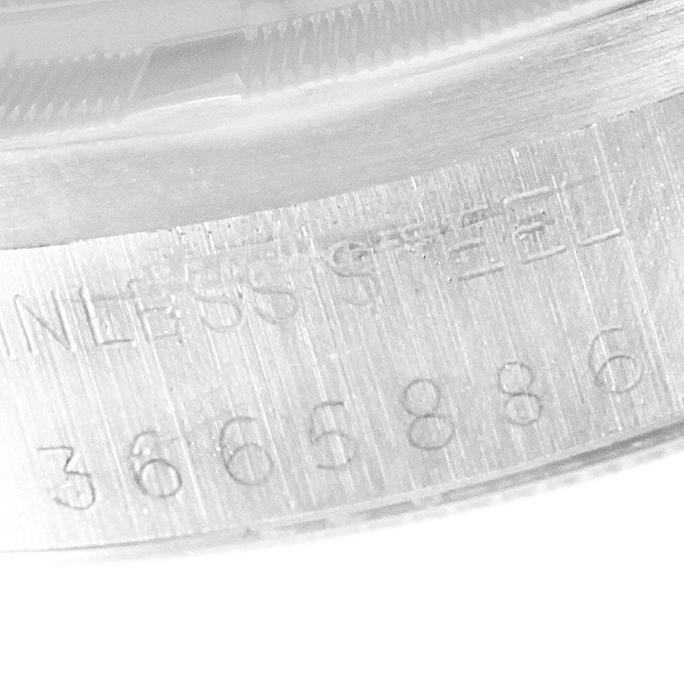 This close-up image shows the serial number and "STAINLESS STEEL" engraving on the case back of a Rolex Vintage Collection 1501 Men's Stainless Steel Silver Dial 1501 Men's Stainless Steel Silver Dial watch.