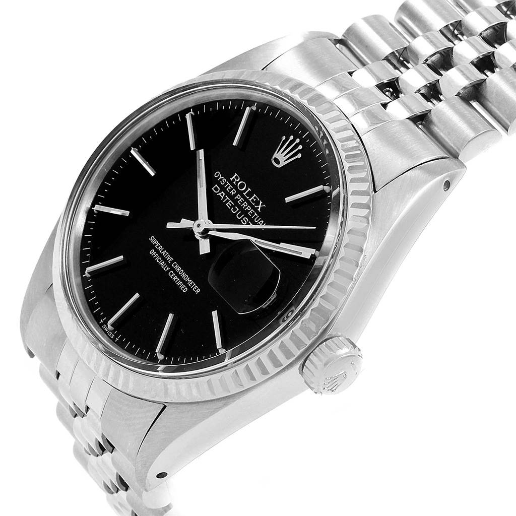 The image shows a close-up of the Rolex Vintage Collection 16014 Men's Stainless Steel Black Dial 16014 Men's Stainless Steel Black Dial Datejust model from an oblique angle, highlighting the dial, bezel, crown, and bracelet.