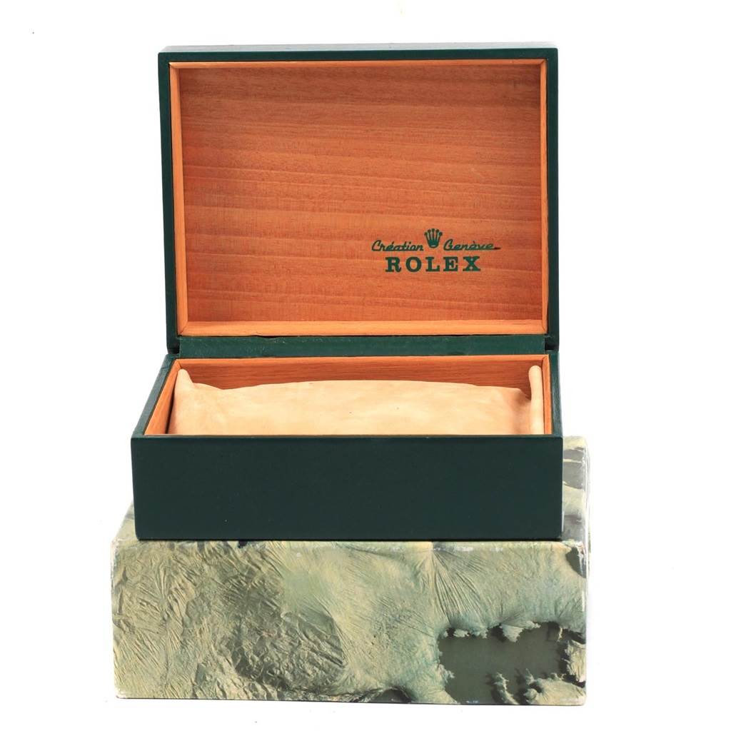 This image shows an open box at a front angle for a Rolex Vintage Collection 16014 Men's Stainless Steel Black Dial 16014 Men's Stainless Steel Black Dial watch, with the brand logo inside the box lid.