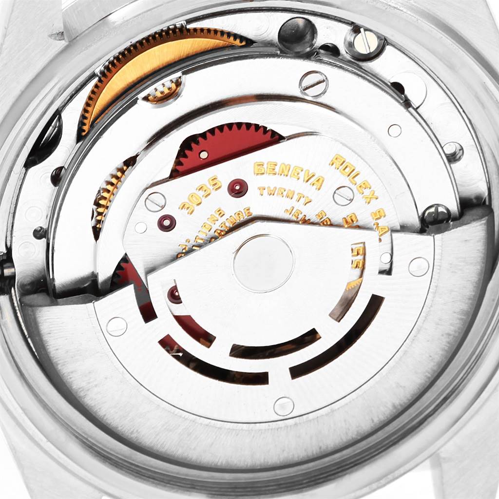 The image shows a detailed view of the movement mechanism of a Rolex Vintage Collection 16014 Men's Stainless Steel Black Dial 16014 Men's Stainless Steel Black Dial watch, focusing on the rotor and gears.