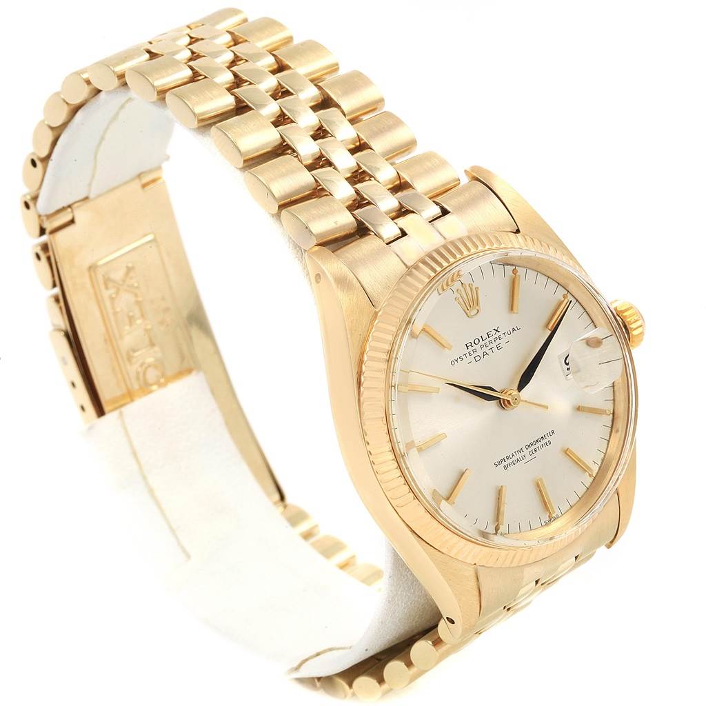 This image shows a side angle of the Rolex Vintage Collection 1500 Men
s Yellow Gold Silver Dial 1500 Men
s Yellow Gold Silver Dial model, highlighting the face, crown, and band.