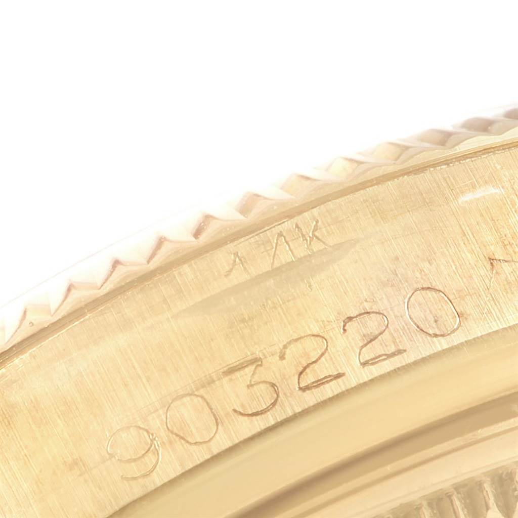 This close-up image shows the engraved serial number on the bezel of a Rolex Vintage Collection 1500 Men
s Yellow Gold Silver Dial 1500 Men
s Yellow Gold Silver Dial watch.