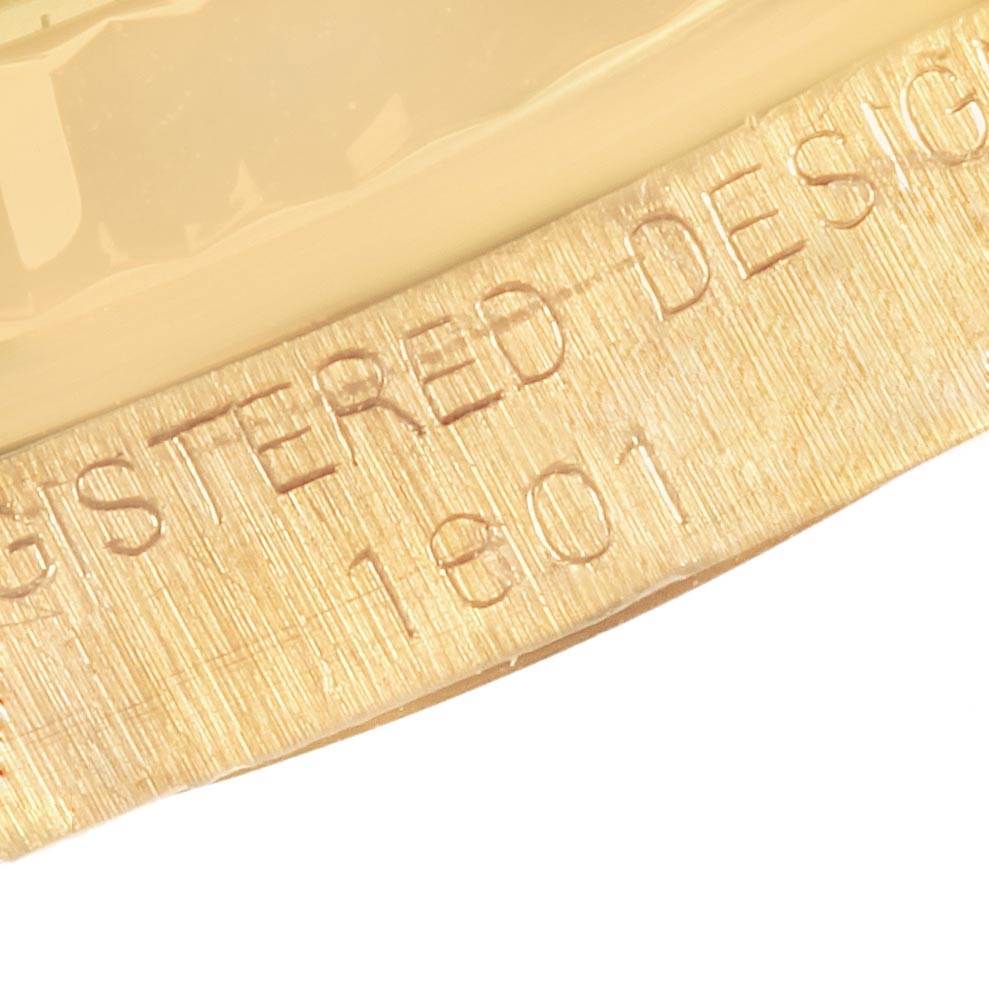 The close-up image shows the engraved bezel or case part with partial text of the Vintage Collection model by Rolex.