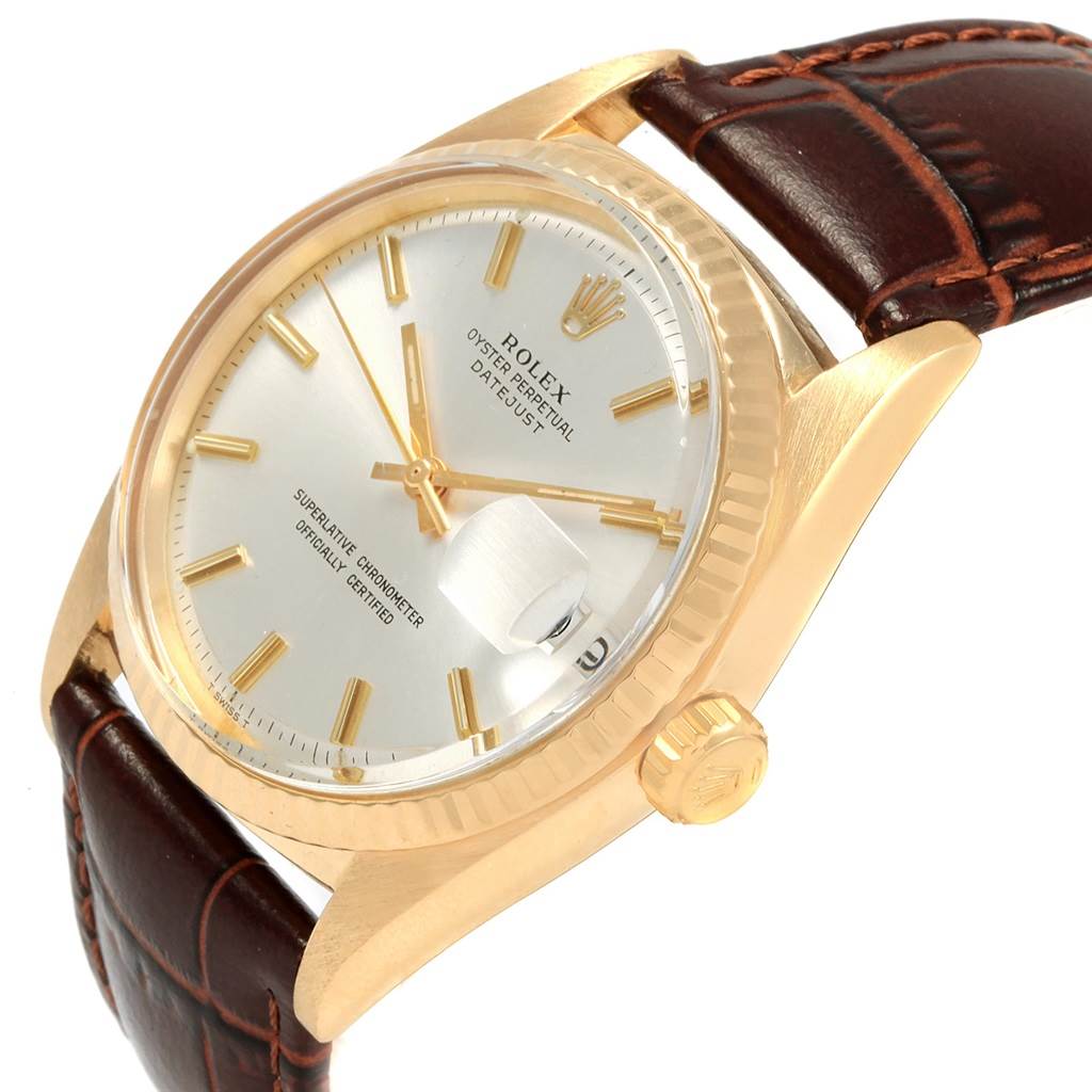 This Rolex Vintage Collection 1601 Men
s Yellow Gold Silver Dial 1601 Men
s Yellow Gold Silver Dial model is shown at an angled side view, highlighting the dial, bezel, crown, and leather strap.