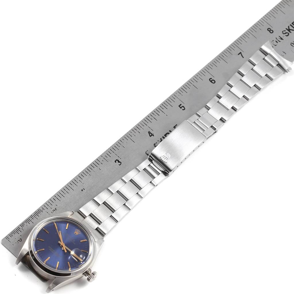 The image shows a Rolex Vintage Collection 1500 Men's Stainless Steel Silver Dial 1500 Men's Stainless Steel Silver Dial watch laid out flat with the strap and clasp visible, positioned next to a ruler.