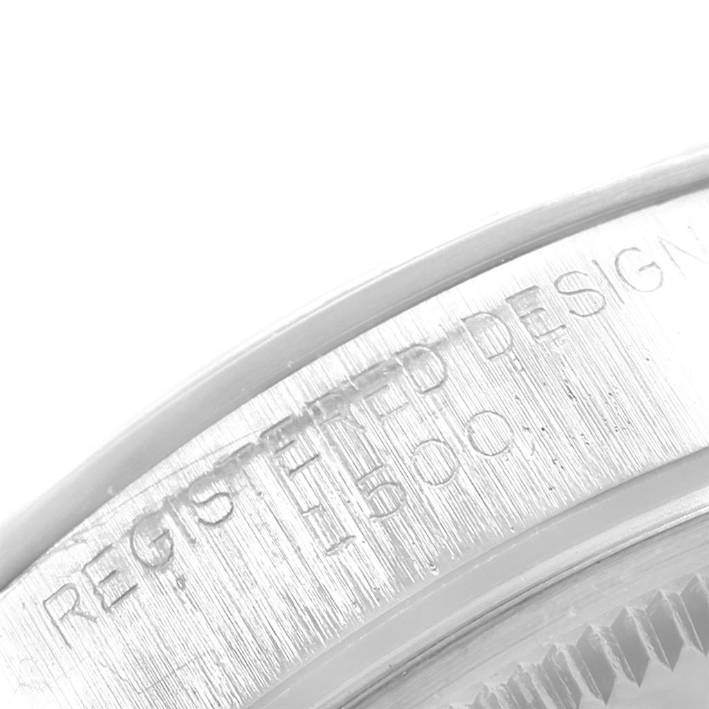 This close-up image shows the engraved serial and model number on the case back edge of the Rolex Vintage Collection 1500 Men's Stainless Steel Silver Dial 1500 Men's Stainless Steel Silver Dial watch.