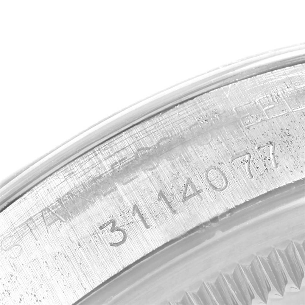 This image shows a close-up of the engraved serial number on the case of a Rolex Vintage Collection 1500 Men's Stainless Steel Silver Dial 1500 Men's Stainless Steel Silver Dial watch.