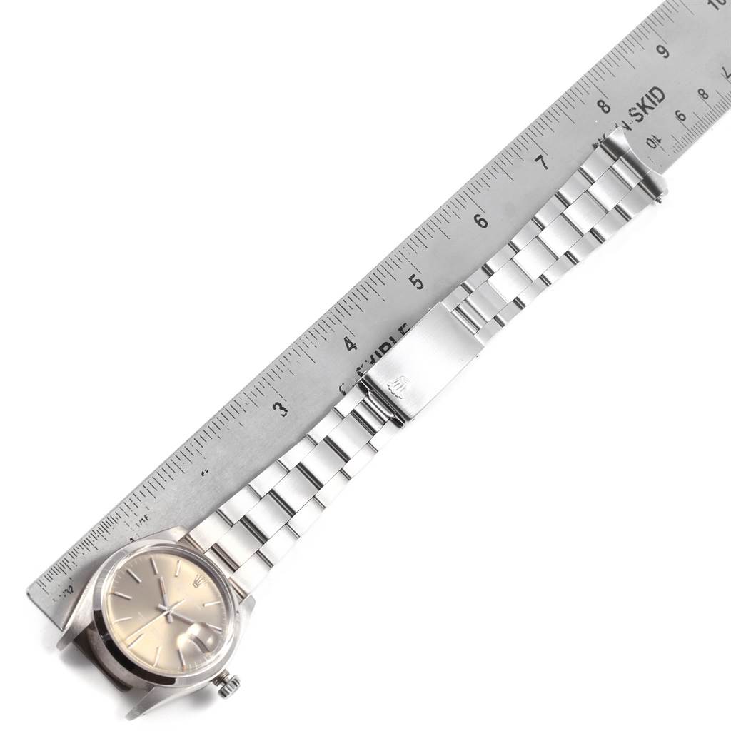The image shows a Rolex Vintage Collection 1500 Men's Stainless Steel Silver Dial 1500 Men's Stainless Steel Silver Dial watch laid flat with the full band and a ruler for scale from a top-down angle.