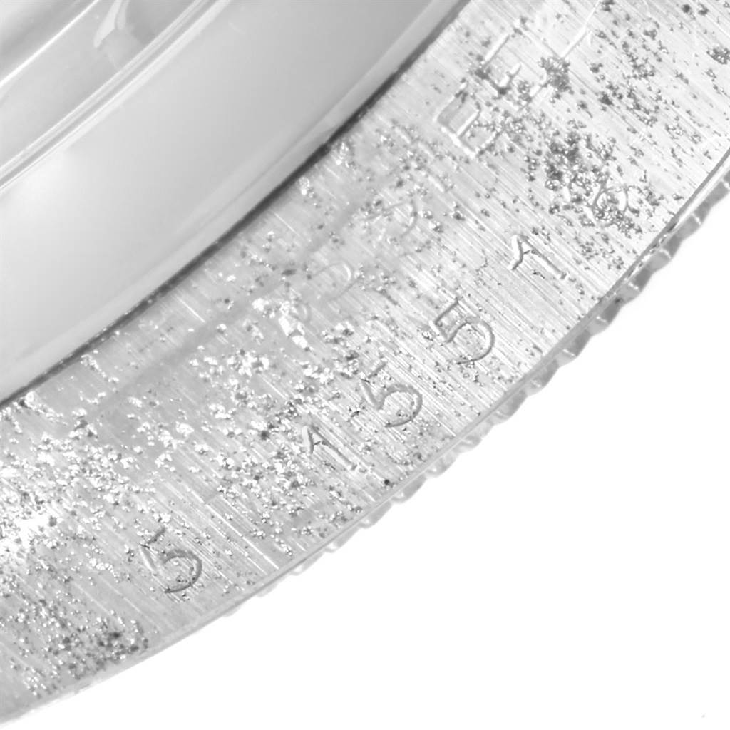 The image shows a close-up of the bezel on a Rolex Vintage Collection 1500 Men's Stainless Steel Silver Dial 1500 Men's Stainless Steel Silver Dial model watch.