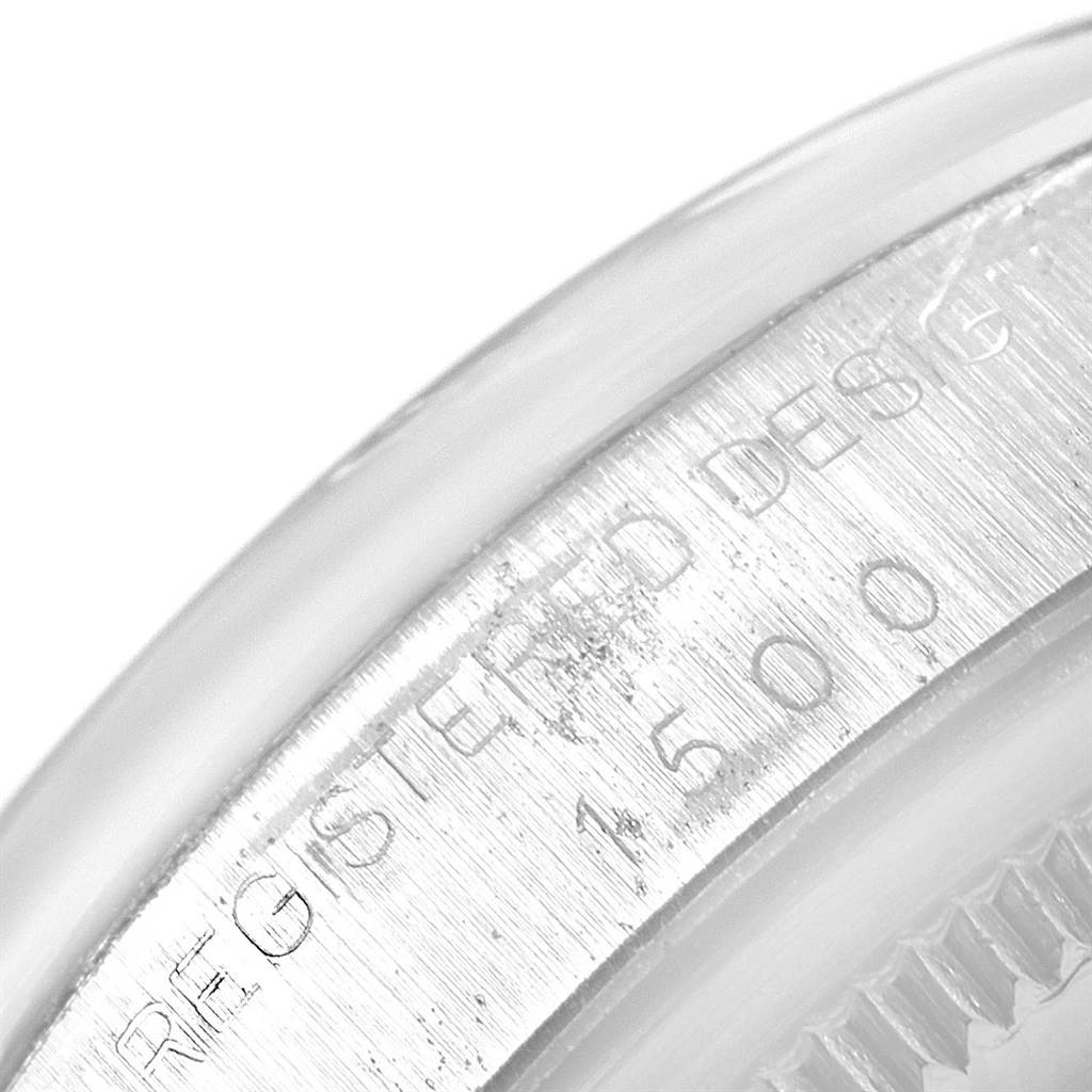 The image shows a close-up angle of the case side and bezel of a Vintage Collection model by Rolex, displaying its registered design number.