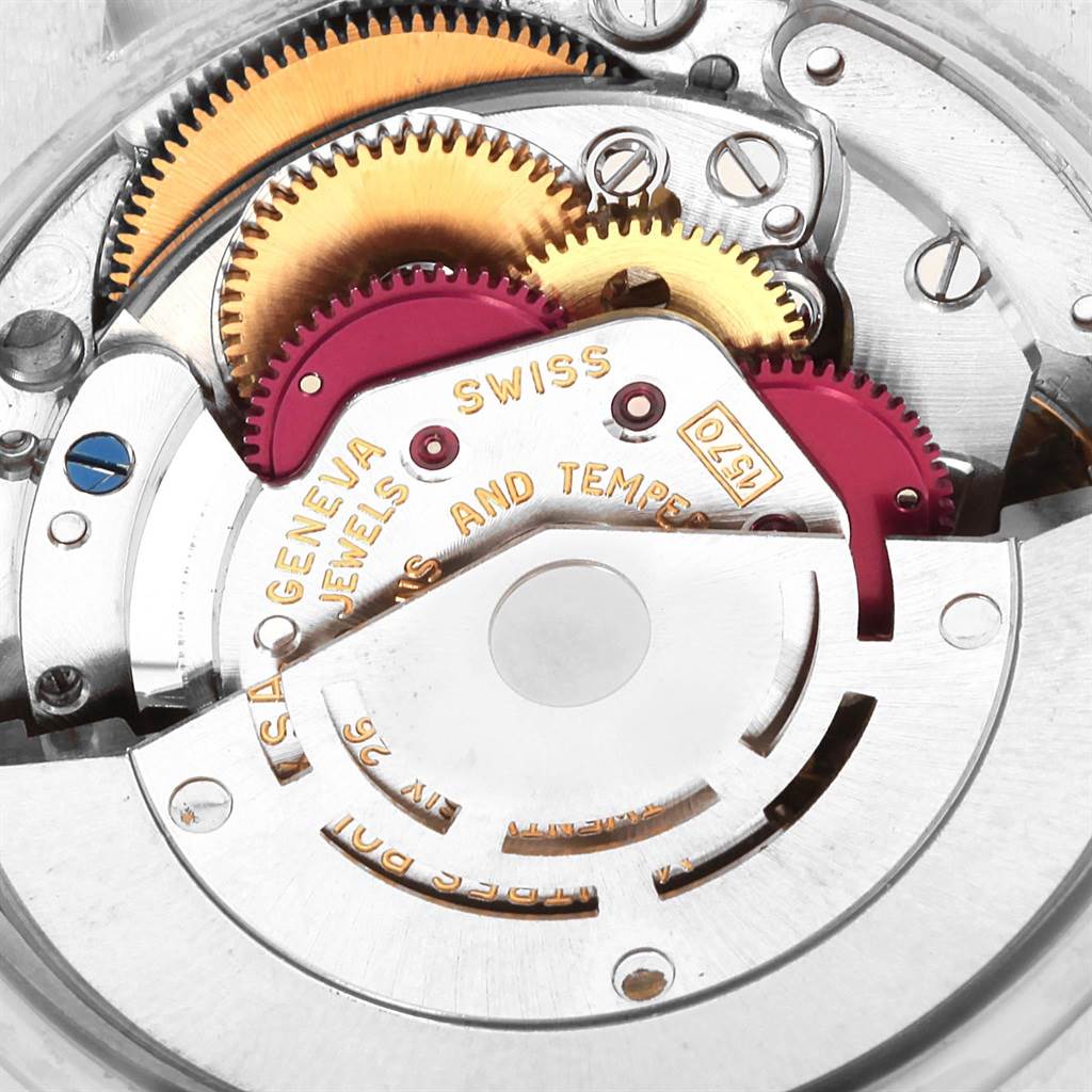 The image shows the intricate internal mechanism of a Vintage Collection model by Rolex, highlighting gears and movement parts.