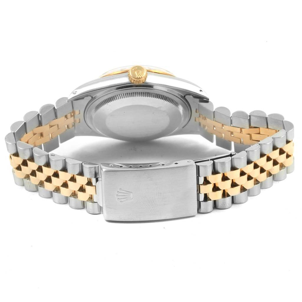 The image shows the back and clasp of a Rolex Vintage Collection 16013 Men's Stainless Steel Champagne Dial 16013 Men's Stainless Steel Champagne Dial watch, highlighting its two-tone metal bracelet.