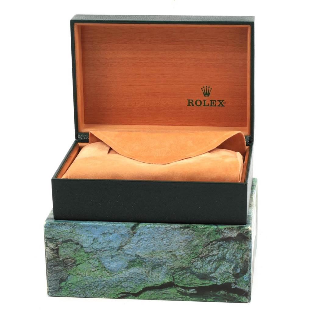 The image shows an open Rolex watch box from the Vintage Collection model, displaying the interior and a suede pouch.