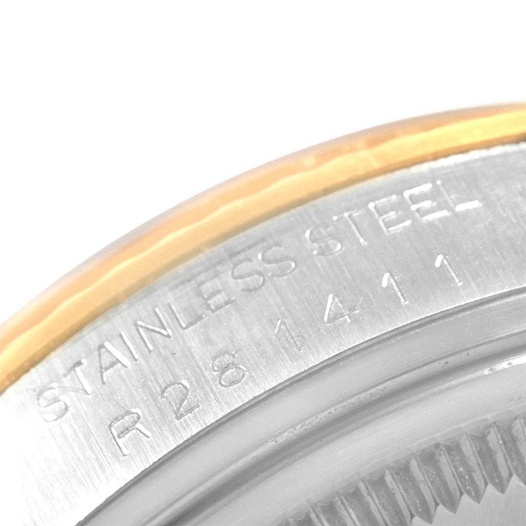 This close-up image of the Rolex Vintage Collection 16013 Men's Stainless Steel Champagne Dial 16013 Men's Stainless Steel Champagne Dial watch shows the stainless steel engraved caseback edge, including serial numbers.