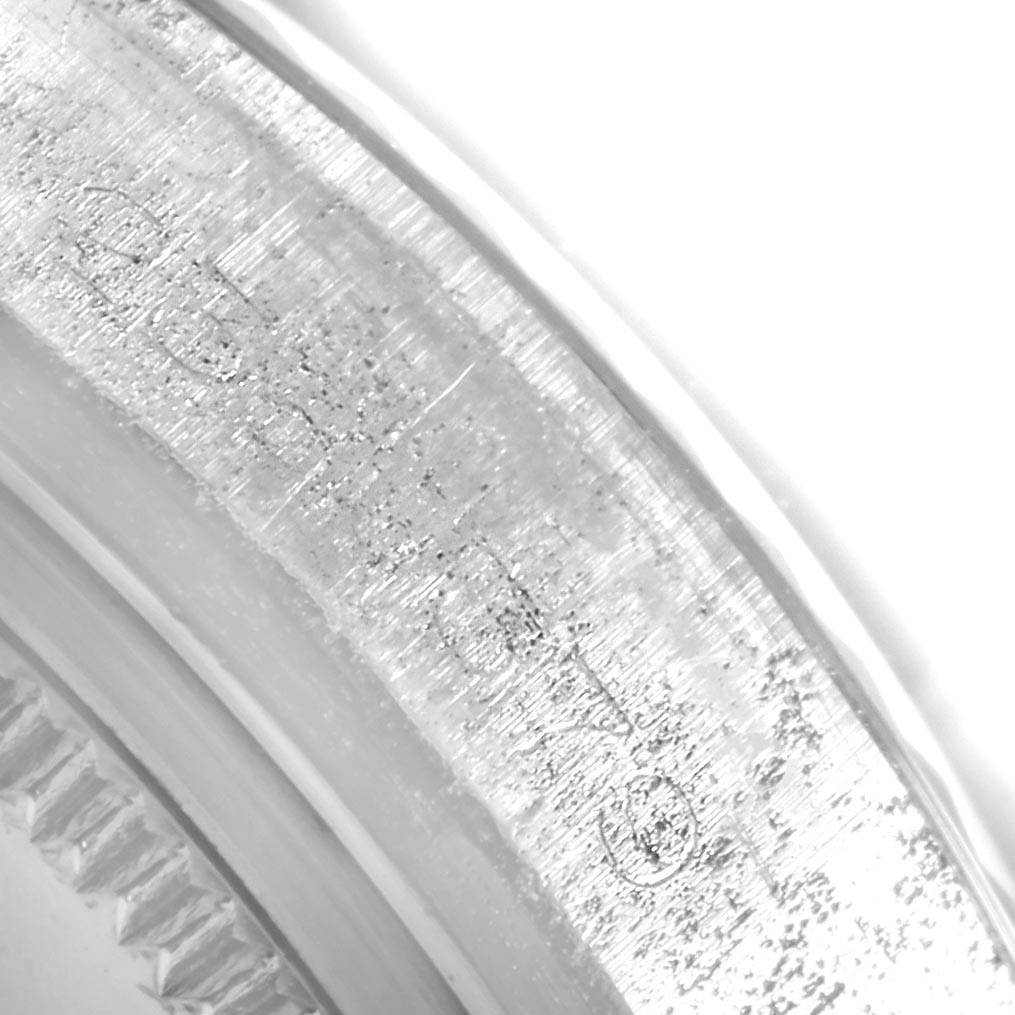 The image shows a close-up of the engraved side bezel of a Vintage Collection model by Rolex.