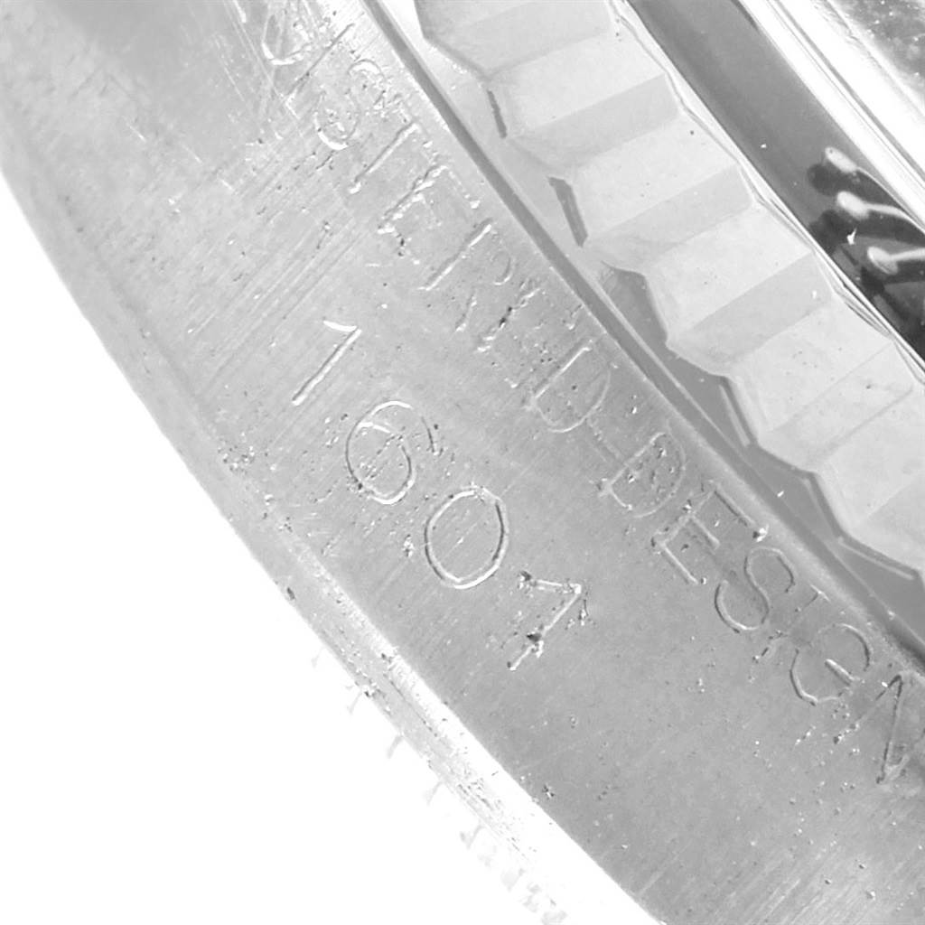 This close-up photo shows the engraved model number "1607" on the metal casing of a Vintage Collection Rolex watch.