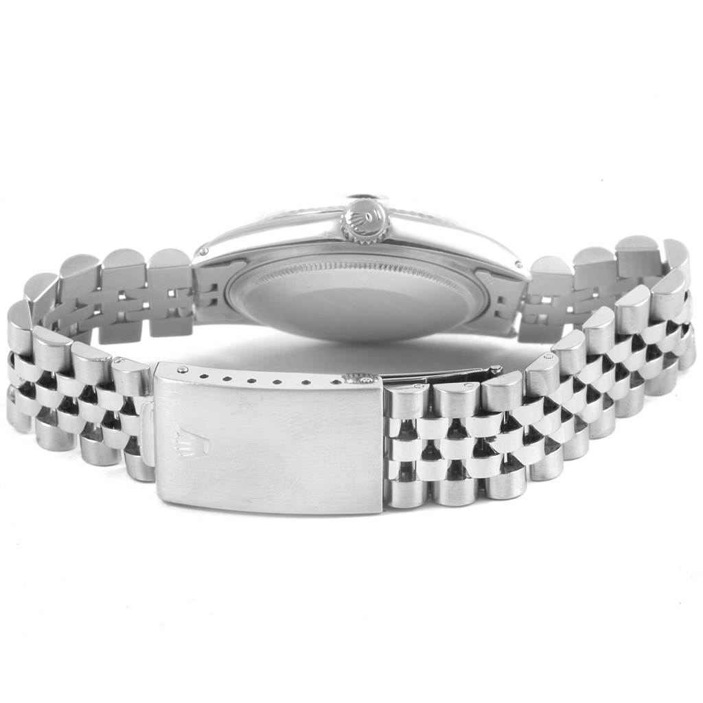 The image shows the back view of a Vintage Collection Rolex watch, highlighting the caseback and bracelet with the clasp.