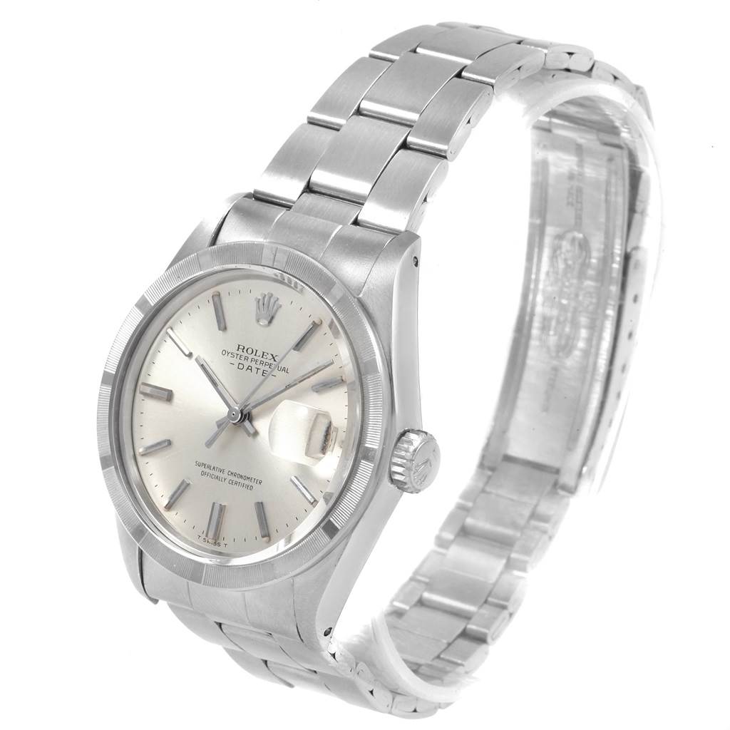 The image shows a side and front angle of a Rolex Vintage Collection 1501 Men's Stainless Steel Silver Dial 1501 Men's Stainless Steel Silver Dial watch with a stainless steel band and a silver dial.