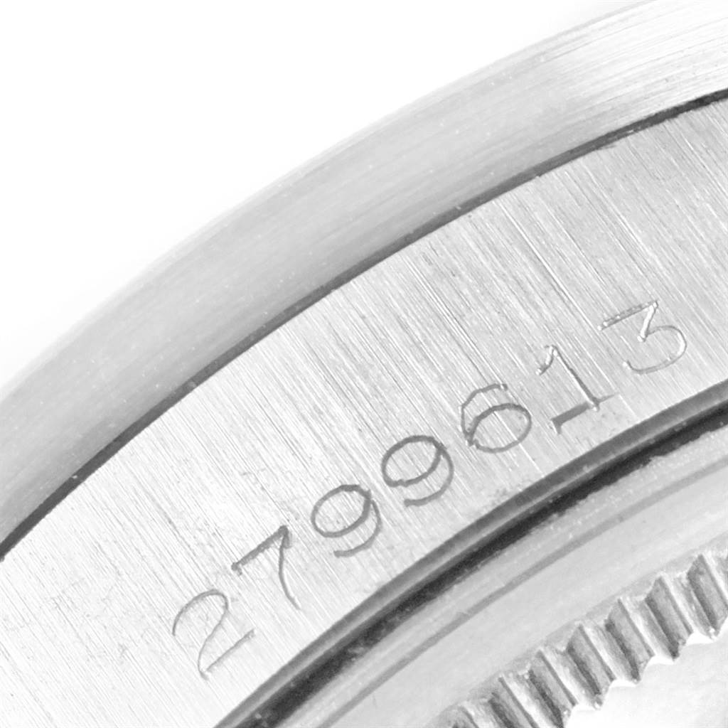 The image shows a close-up of the case back edge with part of the serial number of a Rolex Vintage Collection 1501 Men's Stainless Steel Silver Dial 1501 Men's Stainless Steel Silver Dial watch.