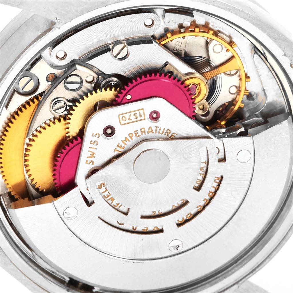 This image shows the internal mechanical movement of a Vintage Collection Rolex watch from an angled close-up.
