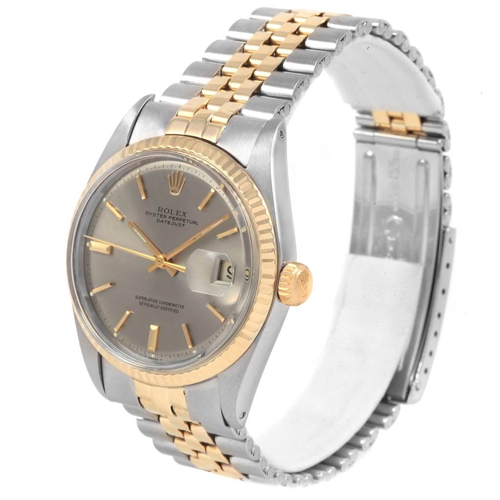 The image shows a Rolex Vintage Collection 1601 Men's Steel and Gold (two tone) Grey Dial 1601 Men's Steel and Gold (two tone) Grey Dial watch at an angle displaying its face, bezel, crown, and steel and gold bracelet.