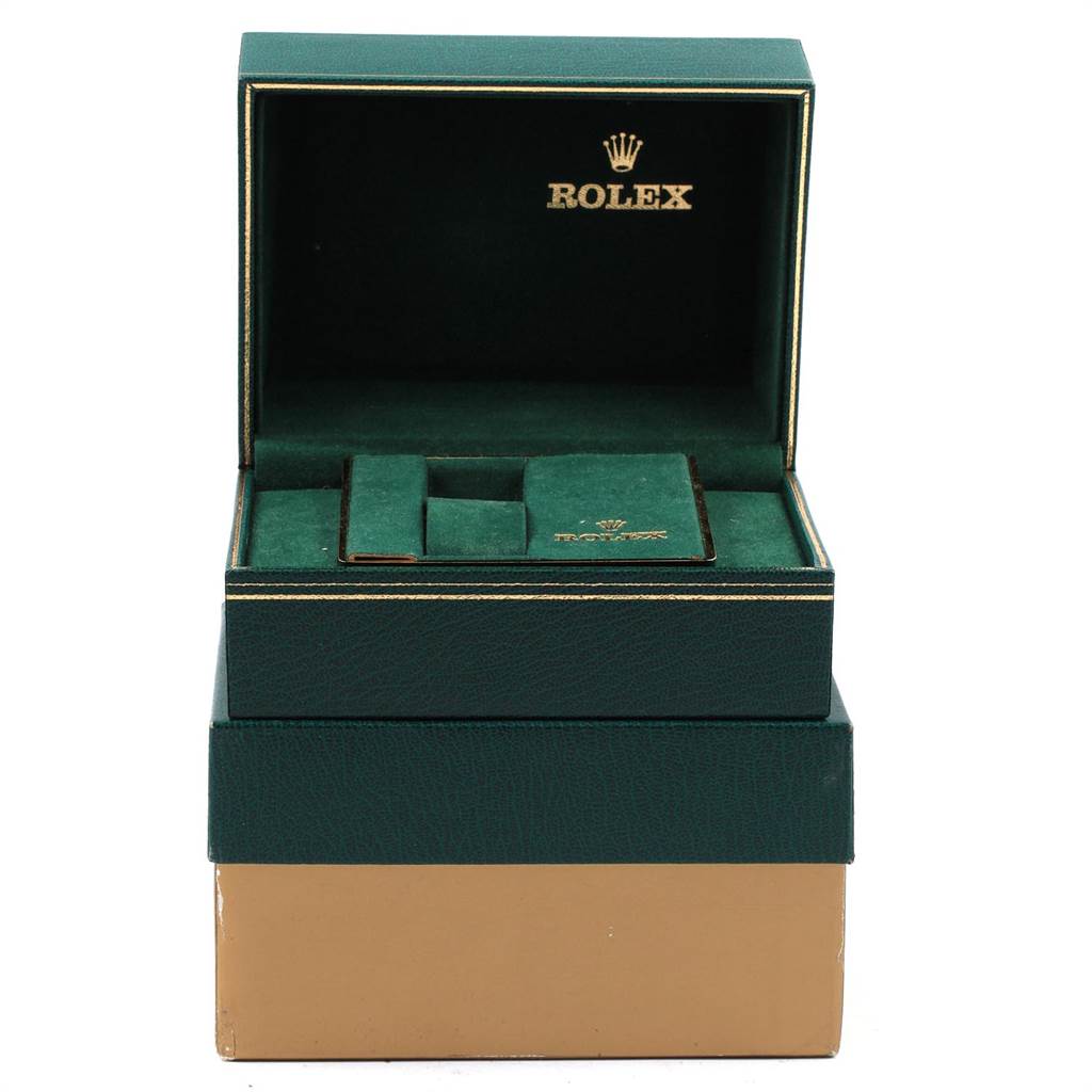 The image shows an open green Rolex box from the Vintage Collection model, displaying compartments for the watch and accessories.