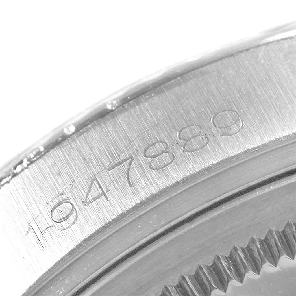 This image shows a close-up of the serial number engraving on the back case of a Rolex Vintage Collection 1601 Men's Stainless Steel Grey Dial 1601 Men's Stainless Steel Grey Dial watch.