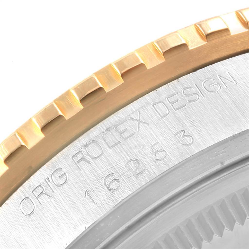This image displays a close-up of the bezel and engraved case back of the Vintage Collection model by Rolex.
