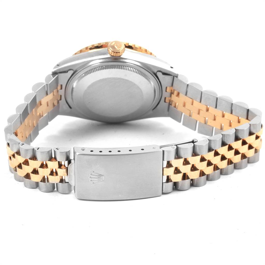 The image shows the back case and two-tone bracelet of a Vintage Collection Rolex watch.