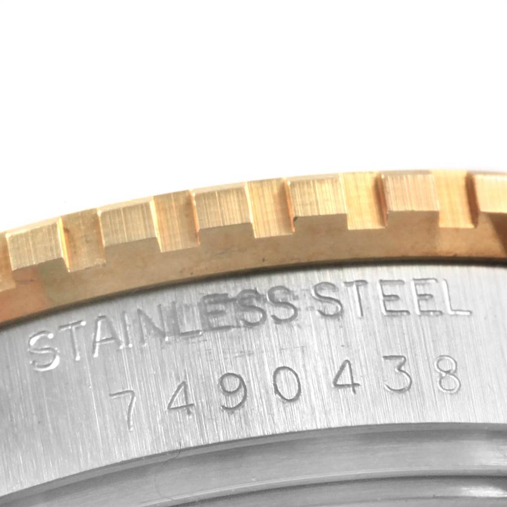 The image shows a close-up of the caseback and bezel of a Rolex Vintage Collection 16253 Men's Steel and Gold (two tone) Blue Dial 16253 Men's Steel and Gold (two tone) Blue Dial watch, highlighting "STAINLESS STEEL" and the serial number.