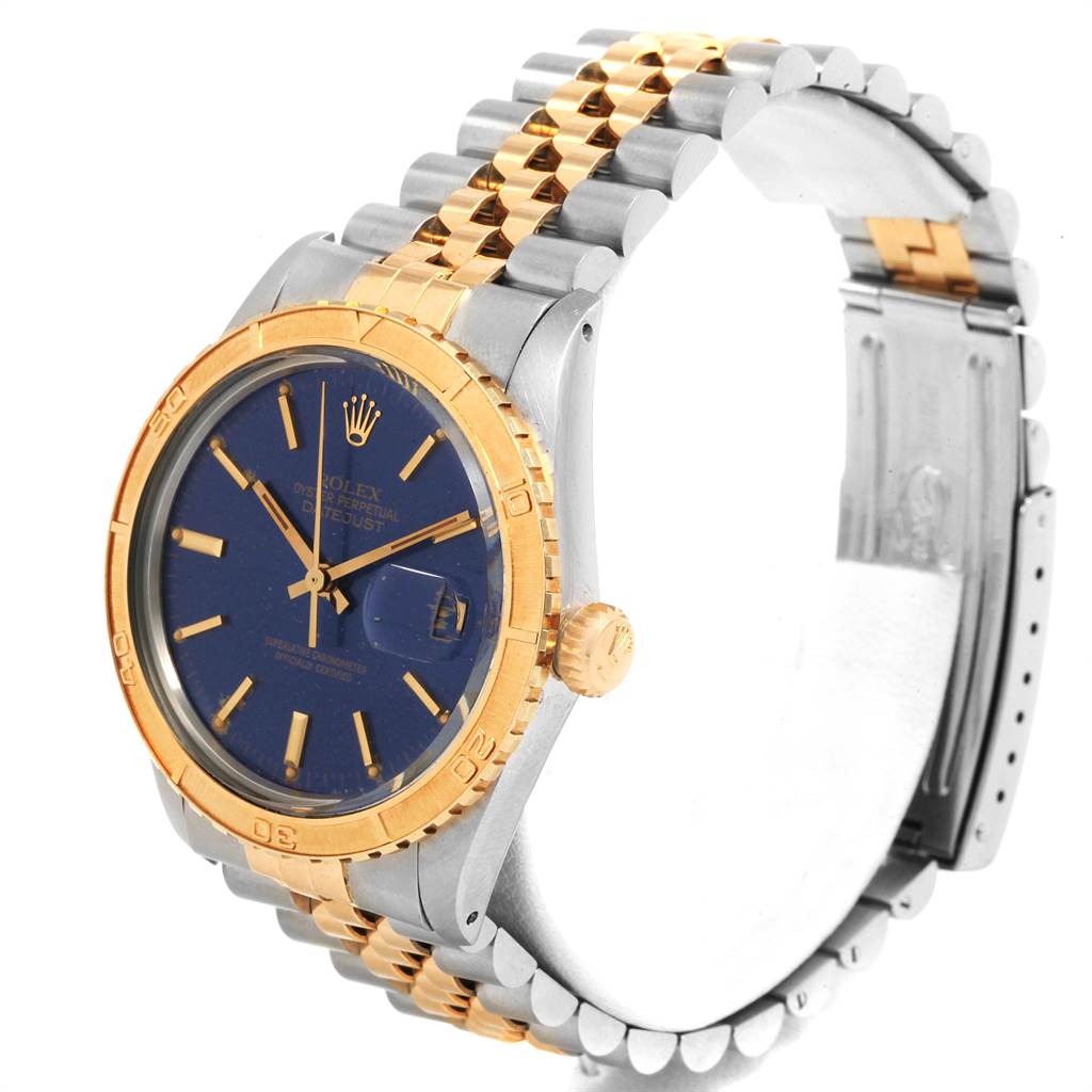 The image shows a side angle of the Rolex Vintage Collection 16253 Men's Steel and Gold (two tone) Blue Dial 16253 Men's Steel and Gold (two tone) Blue Dial watch, highlighting its blue dial, gold bezel, crown, and two-tone bracelet.