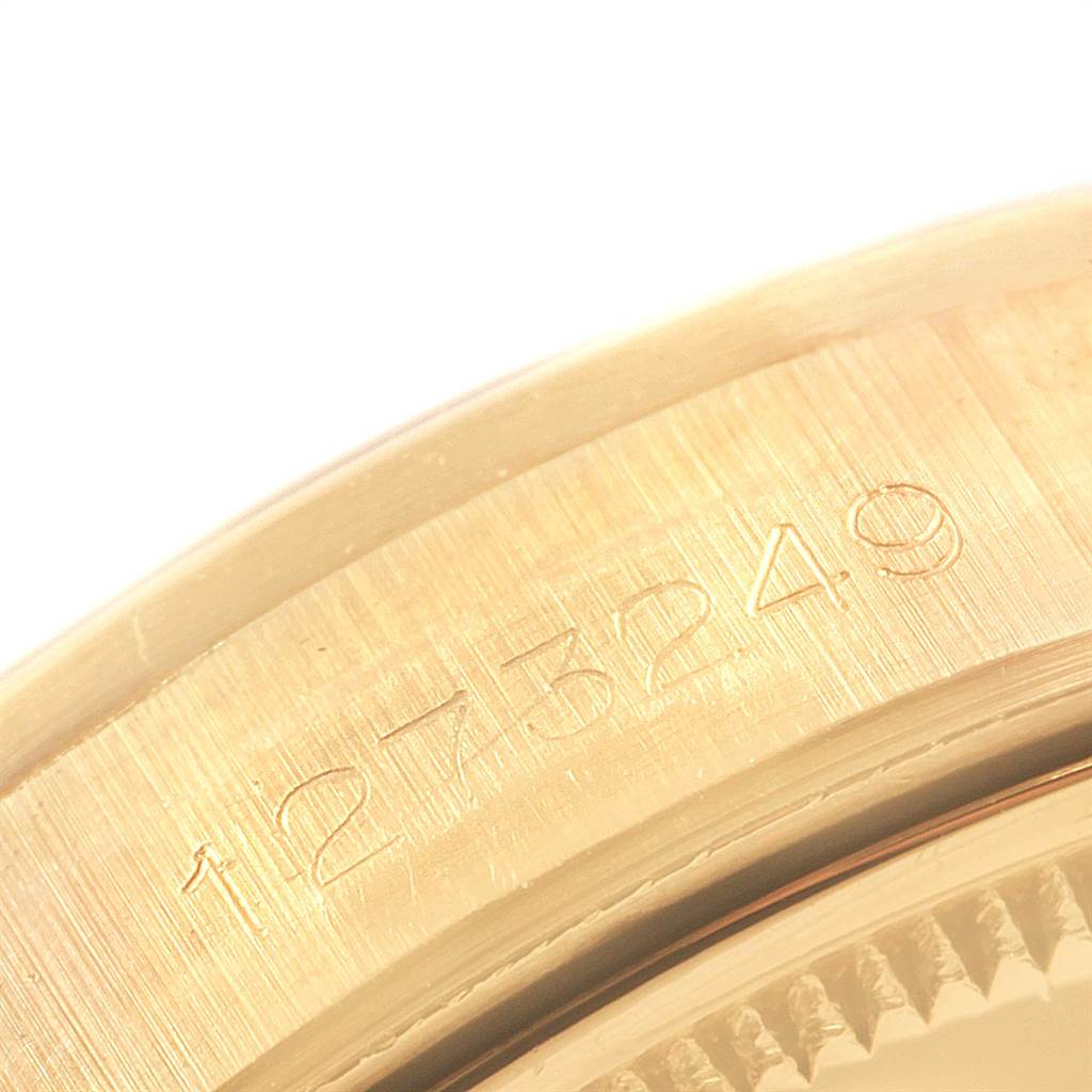This close-up image shows the serial number engraved on the gold case of the Vintage Collection model by Rolex.