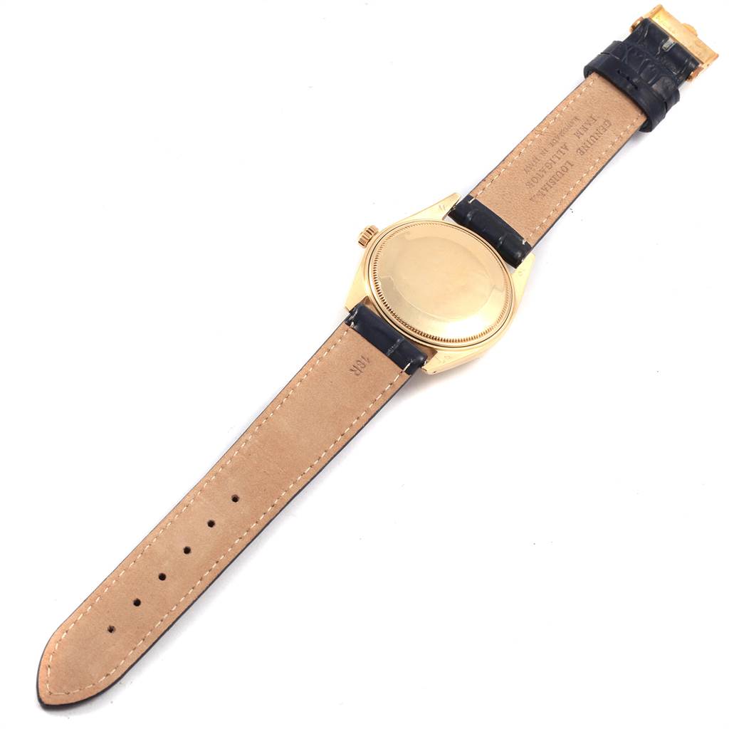 The image shows the back and strap of a Rolex Vintage Collection 1503 Men
s Yellow Gold Blue Dial 1503 Men
s Yellow Gold Blue Dial watch, lying flat with the case back and leather band visible.