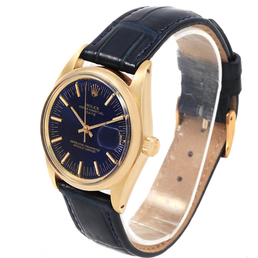 The image shows a side angle of a Rolex Vintage Collection 1503 Men
s Yellow Gold Blue Dial 1503 Men
s Yellow Gold Blue Dial model, featuring the watch face, case, crown, and leather strap.