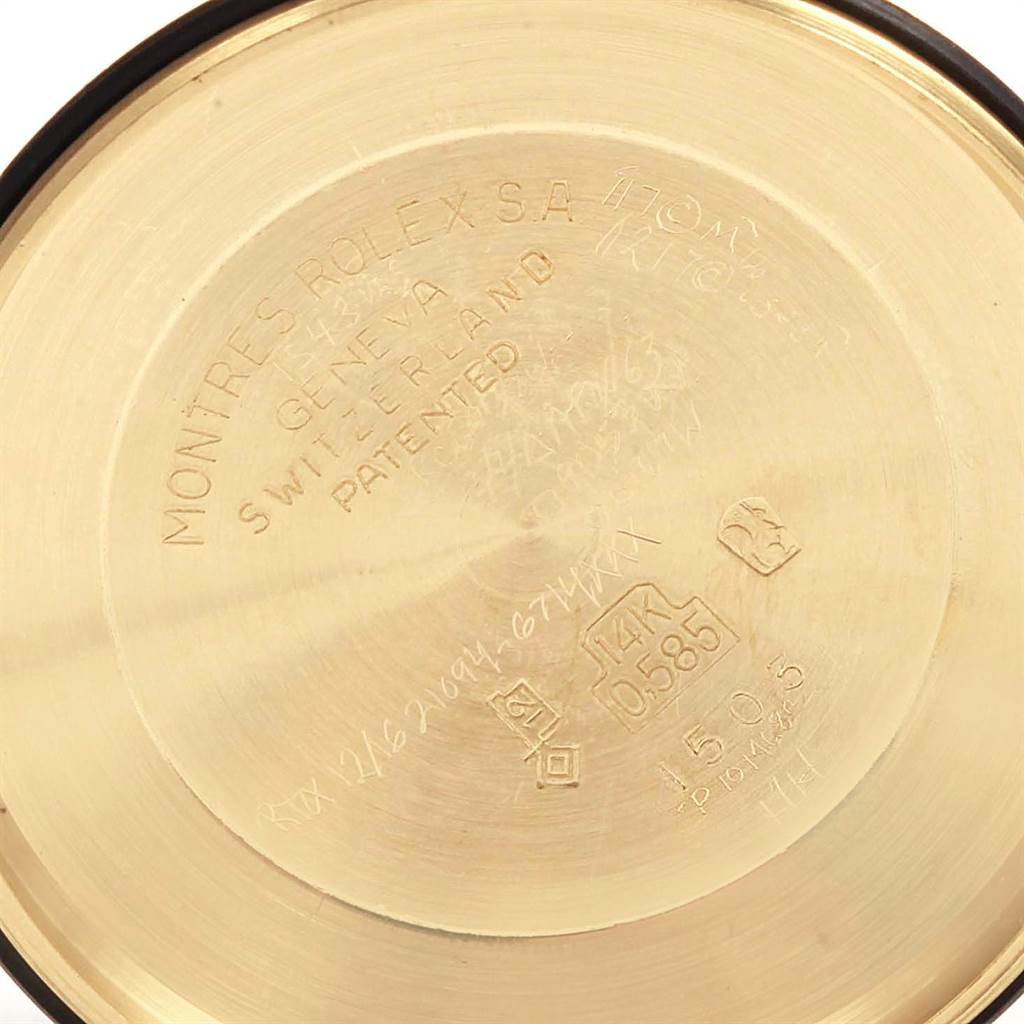 This image shows the inside case back of a Vintage Collection Rolex watch, displaying engravings and hallmarks.