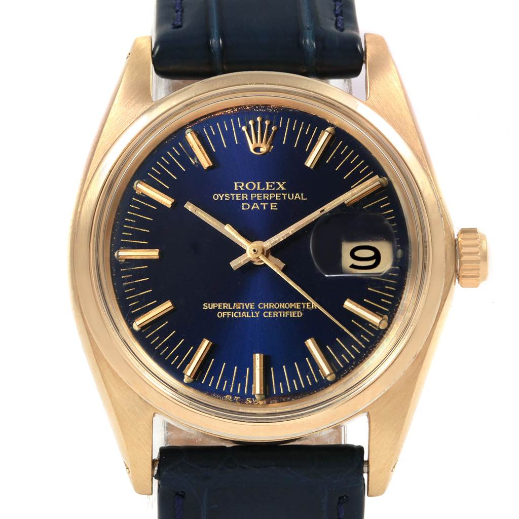 This image shows a front view of the Rolex Vintage Collection 1503 Men
s Yellow Gold Blue Dial 1503 Men
s Yellow Gold Blue Dial watch, highlighting its blue dial, gold markings, and leather strap.