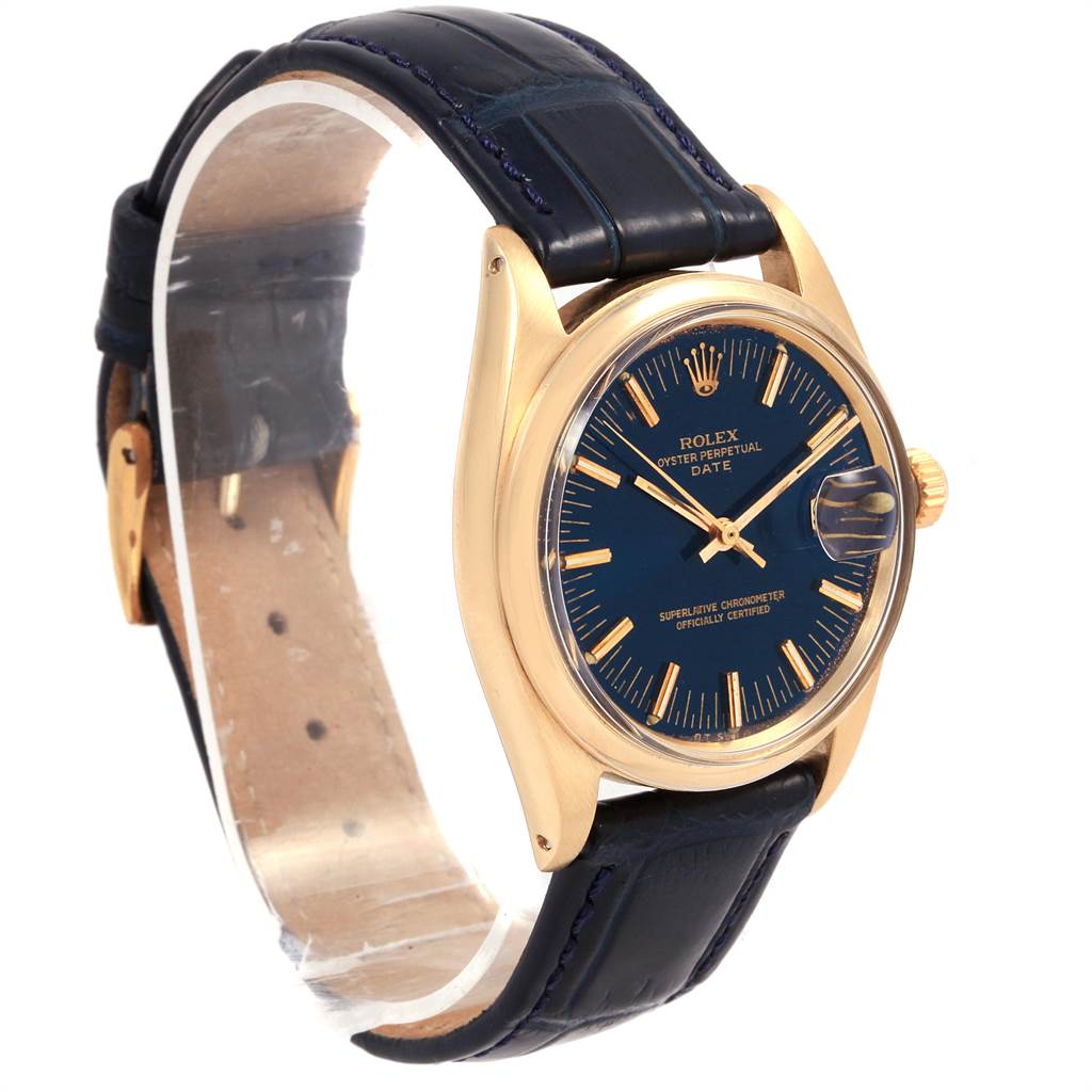 This image shows a side angle of the Rolex Vintage Collection 1503 Men
s Yellow Gold Blue Dial 1503 Men
s Yellow Gold Blue Dial model, featuring its blue dial, gold case, and black leather strap.